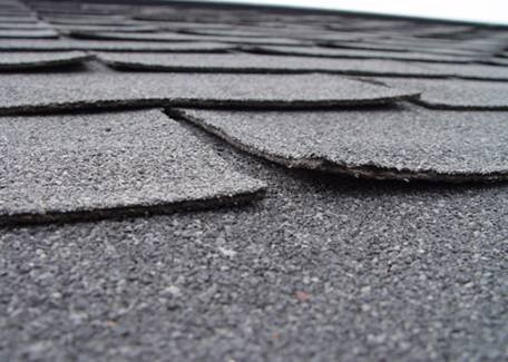 Curled shingle on roof